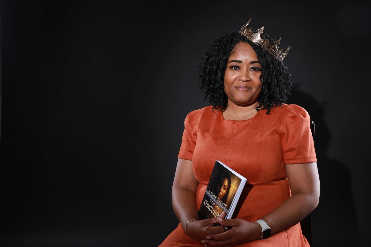 Lakisha Shepard holding her book